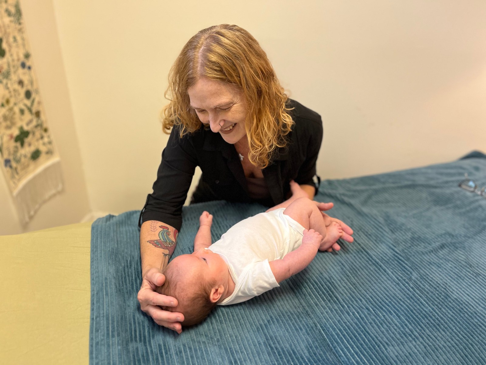 Adelyn Botto provides therapy to an infant.